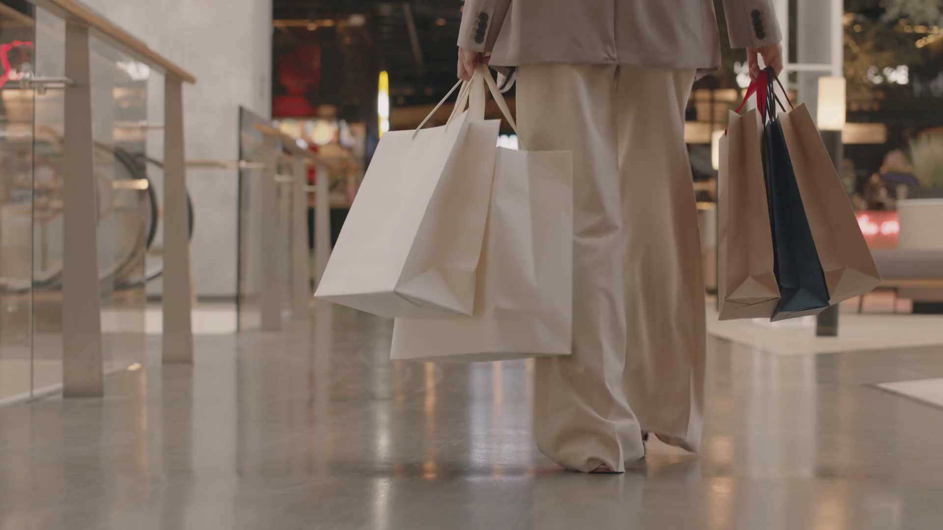 Woman walking in shopping centre